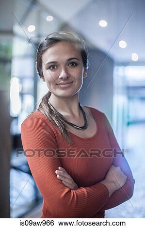 Portrait of young businesswoman, smiling View Large Photo Image Stock Photograph - Portrait of young businesswoman, smiling. Fotosearch