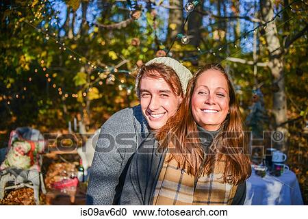 Stock Image - Portrait of young man and mother in woods. Fotosearch