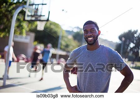 Portrait of young man on basketball court View Large Photo Image Stock Photo - Portrait of young man on basketball court. Fotosearch