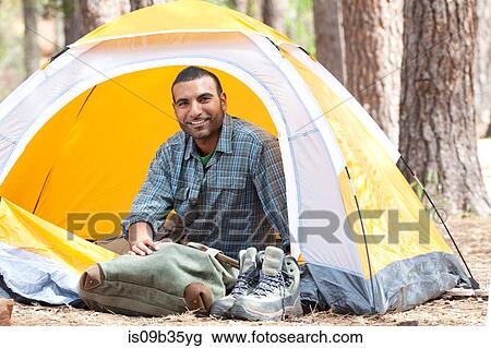 Portrait of young man sitting in dome tent in forest, Sedona, Arizona, USA View Large Photo Image Stock Image - Portrait of young man sitting in dome tent in forest, Sedona, Arizona, USA. Fotosearch