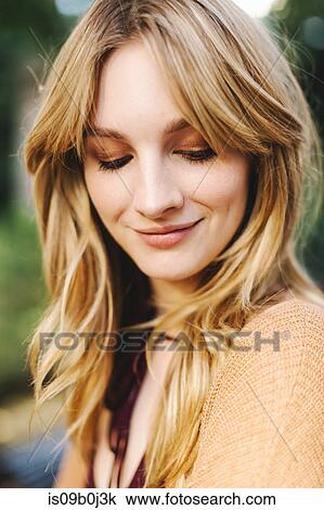 Portrait of young woman, blonde hair, smiling, close-up View Large Photo Image Stock Image - Portrait of young woman, blonde hair, smiling, close-up. Fotosearch