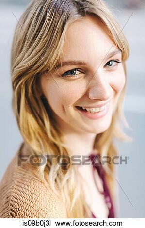 Portrait of young woman, blonde hair, smiling, close-up View Large Photo Image Stock Image - Portrait of young woman, blonde hair, smiling, close-up. Fotosearch