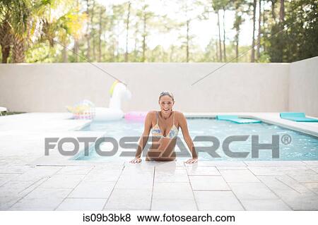 Portrait of young woman in swimming pool, Santa Rosa Beach, Florida, USA View Large Photo Image Stock Photo - Portrait of young woman in swimming pool, Santa Rosa Beach, Florida, USA. Fotosearch
