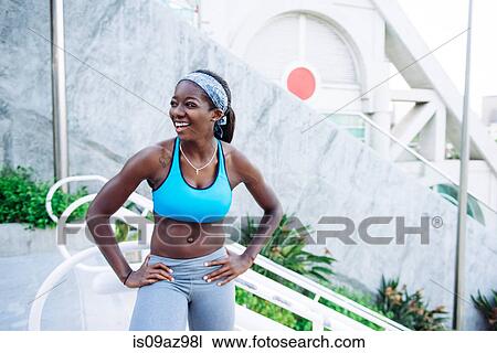 Portrait of young woman training, taking a break at sport facility, downtown San Diego, California, USA View Large Photo Image Stock Image - Portrait of young woman training, taking a break at sport facility, downtown San Diego, California, USA. Fotosearch