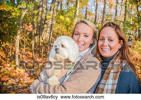 Portrait of young woman with mother and dog in woods View Large Photo Image Stock Photo - Portrait of young woman with mother and dog in woods. Fotosearch
