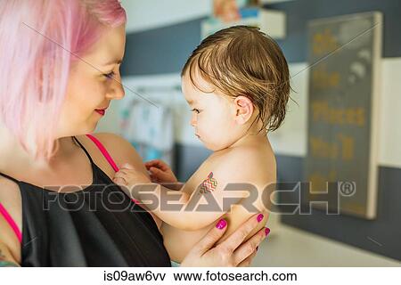 Portrait of young woman with pink hair and baby son View Large Photo Image Stock Photo - Portrait of young woman with pink hair and baby son. Fotosearch