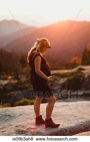 Pregnant woman in mountains touching stomach, Sequoia national park, California, USA View Large Photo Image Stock Photo - Pregnant woman in mountains touching stomach, Sequoia national park, California, USA. Fotosearch