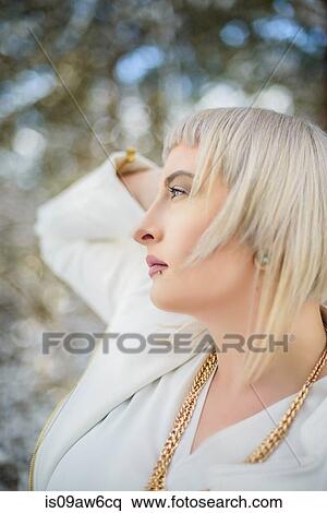 Profile of young woman against winter landscape View Large Photo Image Stock Photography - Profile of young woman against winter landscape. Fotosearch