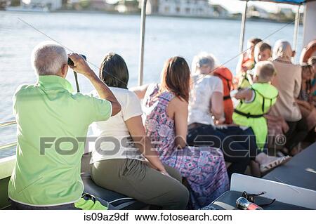 Rear view of adult and children looking out on tourist boat trip, Cape Town, South Africa View Large Photo Image Stock Image - Rear view of adult and children looking out on tourist boat trip, Cape Town, South Africa. Fotosearch