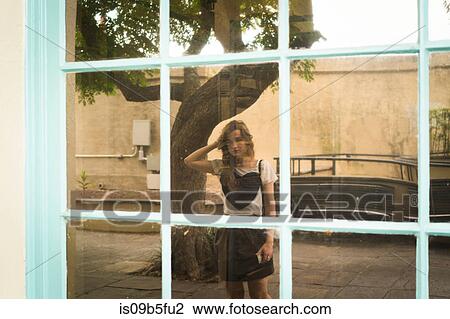Reflection of woman in shop window View Large Photo Image Stock Image - Reflection of woman in shop window. Fotosearch