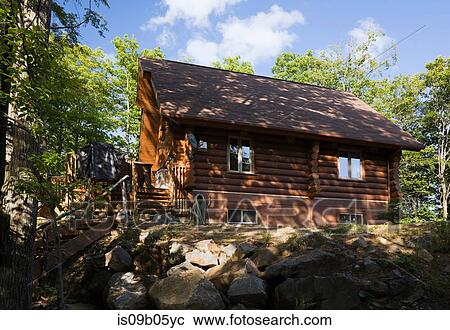 Residential log home in summertime, Quebec, Canada View Large Photo Image Stock Image - Residential log home in summertime, Quebec, Canada. Fotosearch