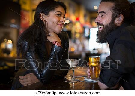 Romantic young couple with cocktail and beer in public house View Large Photo Image Stock Photography - Romantic young couple with cocktail and beer in public house. Fotosearch