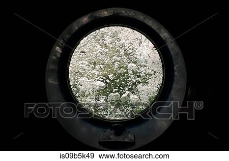 Round glass door to bubbling sea water View Large Photo Image Stock Photo - Round glass door to bubbling sea water. Fotosearch