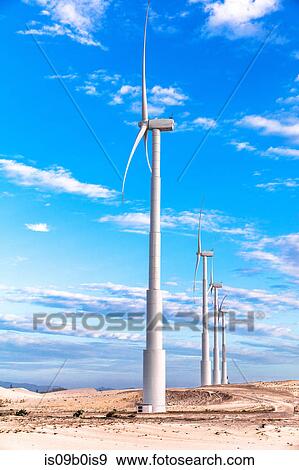 Row of wind turbines in desert, Taiba, Ceara, Brazil View Large Photo Image Stock Photo - Row of wind turbines in desert, Taiba, Ceara, Brazil. Fotosearch