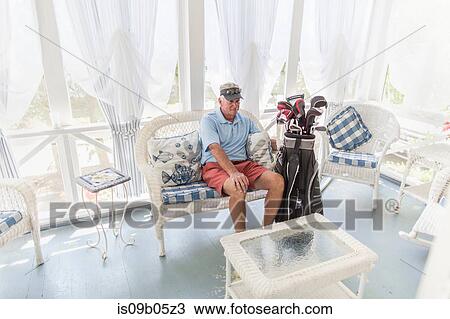 Senior male golfer sitting in conservatory with golf bag View Large Photo Image Stock Image - Senior male golfer sitting in conservatory with golf bag. Fotosearch