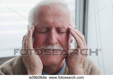 Senior man suffering from headache View Large Photo Image Stock Photo - Senior man suffering from headache. Fotosearch