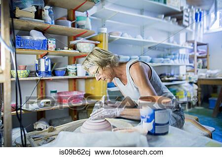 Senior woman in pottery workshop, painting bowl View Large Photo Image Stock Image - Senior woman in pottery workshop, painting bowl. Fotosearch