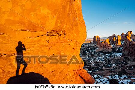 Shadow of man standing on rock, Moab, Utah, USA View Large Photo Image Stock Photography - Shadow of man standing on rock, Moab, Utah, USA. Fotosearch