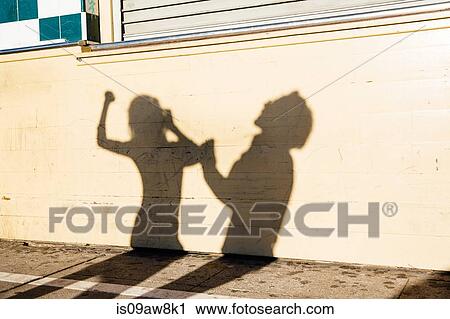 Shadow on wall of couple dancing, outdoors View Large Photo Image Stock Image - Shadow on wall of couple dancing, outdoors. Fotosearch
