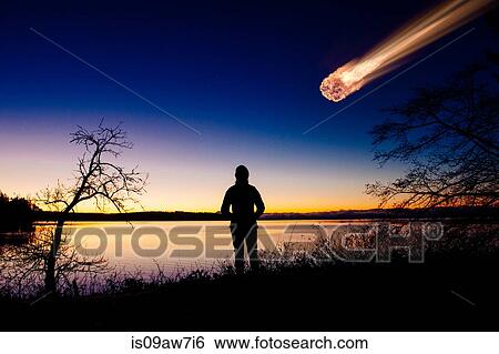 Silhouette of adult watching meteor falling in night sky View Large Photo Image Stock Photograph - Silhouette of adult watching meteor falling in night sky. Fotosearch