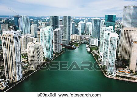 Skyscrapers and helicopter above Miami River, Brickell, Downtown Miami, Florida, USA View Large Photo Image Stock Image - Skyscrapers and helicopter above Miami River, Brickell, Downtown Miami, Florida, USA. Fotosearch