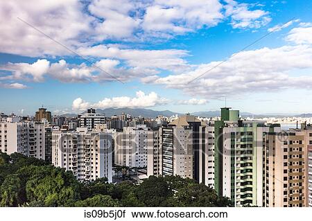 Stock Image - Skyscrapers under cloudy blue sky, Florianopolis, Santa Catarina, Brazil. Fotosearch