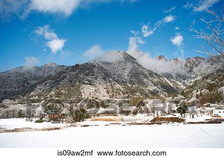Stock Image - Snow covered landscape and mountains, Lake Kawaguchiko, Mount Fuji, Japan. Fotosearch