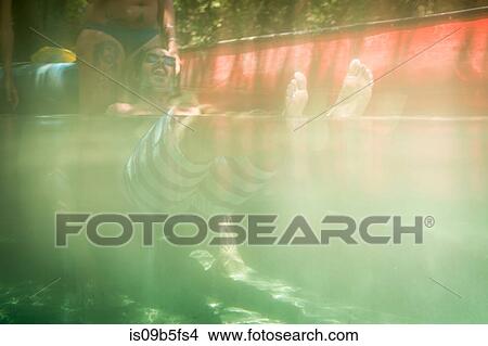Split water surface view of mature couple in Econfina Creek, Youngstown, Florida, USA View Large Photo Image Picture - Split water surface view of mature couple in Econfina Creek, Youngstown, Florida, USA. Fotosearch