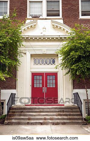 Stairway entrance to traditional elementary school with red door View Large Photo Image Stock Image - Stairway entrance to traditional elementary school with red door. Fotosearch