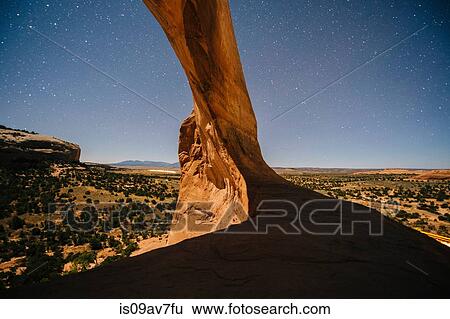 Starry sky and arch rock formation at night, Moab, Utah, USA View Large Photo Image Stock Photograph - Starry sky and arch rock formation at night, Moab, Utah, USA. Fotosearch