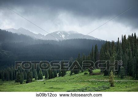 Picture - Storm clouds over mountain landscape, Crested Butte, Colorado, USA. Fotosearch
