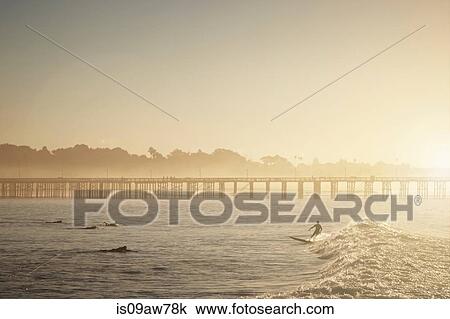 Surfer in ocean, Ventura, California View Large Photo Image Stock Image - Surfer in ocean, Ventura, California. Fotosearch