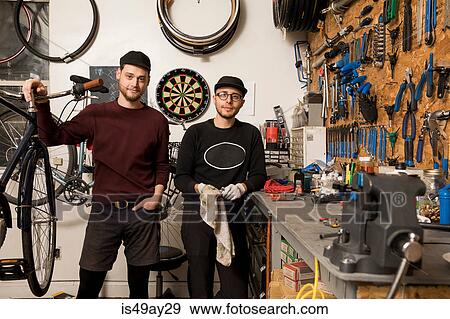 Technicians in bicycle workshop View Large Photo Image Stock Photo - Technicians in bicycle workshop. Fotosearch
