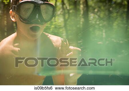 Teenage boy wearing snorkel holding common snapping turtle, Econfina Creek, Youngstown, Florida, USA View Large Photo Image Stock Photograph - Teenage boy wearing snorkel holding common snapping turtle, Econfina Creek, Youngstown, Florida, USA. Fotosearch