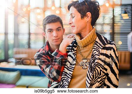 Teenage boy with stylish mother View Large Photo Image Stock Photography - Teenage boy with stylish mother. Fotosearch