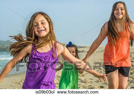 Teenage girl and two sisters on beach, Asbury Park, New Jersey, USA View Large Photo Image Stock Image - Teenage girl and two sisters on beach, Asbury Park, New Jersey, USA. Fotosearch