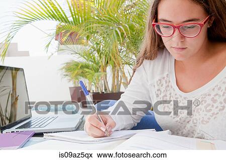 Teenage girl with text books studying View Large Photo Image Stock Photo - Teenage girl with text books studying. Fotosearch