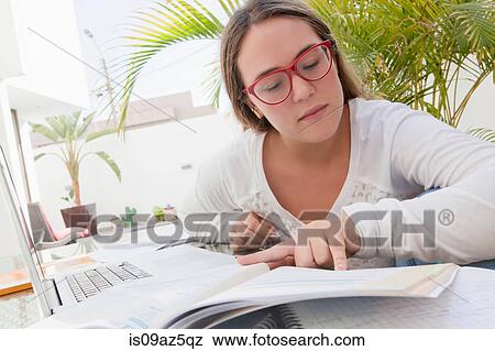Teenage girl with text books studying View Large Photo Image Stock Photo - Teenage girl with text books studying. Fotosearch