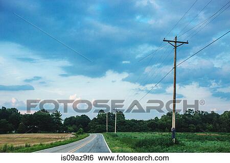 Telegraph poles and diminishing perspective of rural road View Large Photo Image Stock Photograph - Telegraph poles and diminishing perspective of rural road. Fotosearch