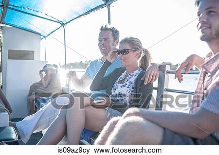 Tourist couple relaxing on boat trip, Cape Town, South Africa View Large Photo Image Stock Photo - Tourist couple relaxing on boat trip, Cape Town, South Africa. Fotosearch