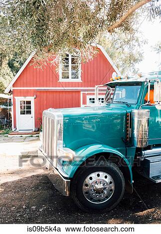 Stock Image - Tractor outside house, Santa Barbara, California, US. Fotosearch