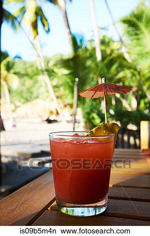Tropical rum punch cocktail at the beach, Saint Lucia, Caribbean View Large Photo Image Picture - Tropical rum punch cocktail at the beach, Saint Lucia, Caribbean. Fotosearch