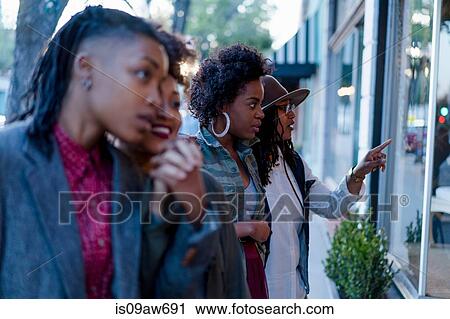 Two lesbian couples, window shopping View Large Photo Image Stock Image - Two lesbian couples, window shopping. Fotosearch