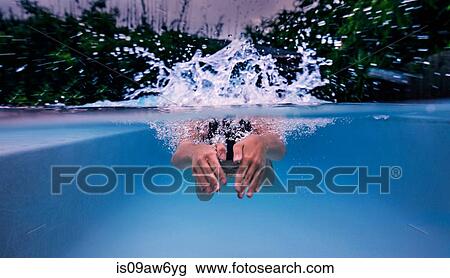 Underwater view of teenage girl swimming and splashing pool surface View Large Photo Image Stock Image - Underwater view of teenage girl swimming and splashing pool surface. Fotosearch