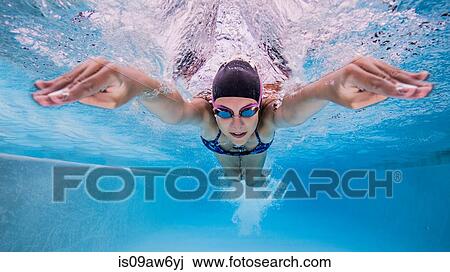 Underwater view of teenage girl swimming in pool View Large Photo Image Stock Image - Underwater view of teenage girl swimming in pool. Fotosearch