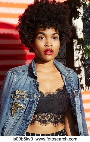 Urban portrait of young female fashion blogger with afro hair, New York, USA View Large Photo Image Stock Image - Urban portrait of young female fashion blogger with afro hair, New York, USA. Fotosearch