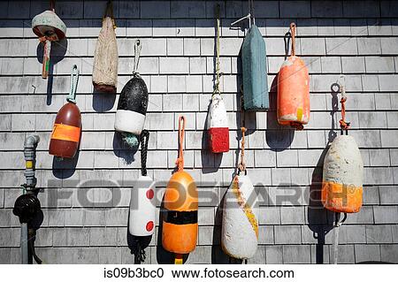 Variety of traditional fishing buoys hanging on wall, Lunenburg, Nova Scotia, Canada View Large Photo Image Stock Image - Variety of traditional fishing buoys hanging on wall, Lunenburg, Nova Scotia, Canada. Fotosearch