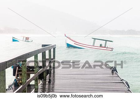 Stock Image - View of fishing boats in sea from pier, Florianopolis, Santa Catarina, Brazil. Fotosearch
