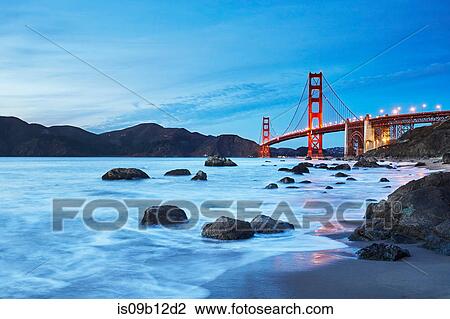 Stock Image - View of Golden Gate Bridge from Marshall's Beach at dusk, San Francisco, California, USA. Fotosearch