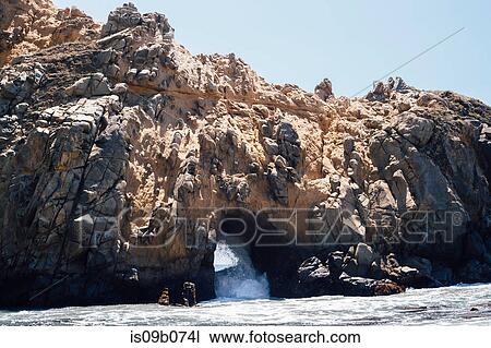 Stock Image - View of rock formation arch and sea, Julia Pfeiffer Burns State Park, Big Sur, California, USA. Fotosearch